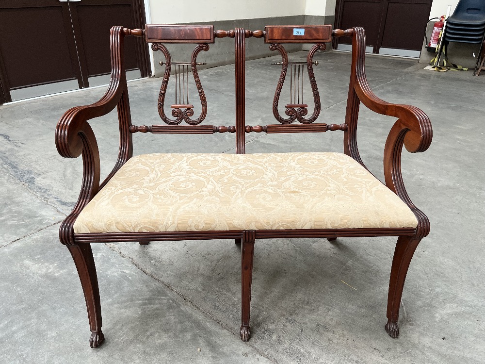 A mahogany double chair-back settee with lyre splats