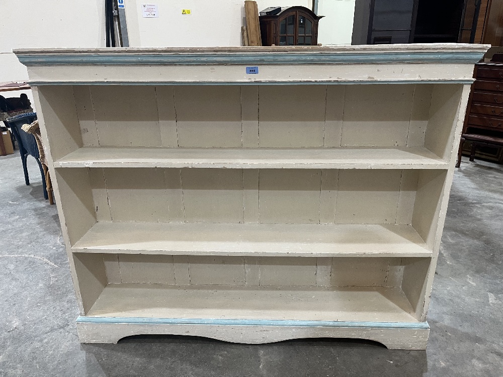 An early 20th century painted open bookcase on bracket feet. 56¼' wide x 45' high