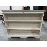 An early 20th century painted open bookcase on bracket feet. 56¼' wide x 45' high