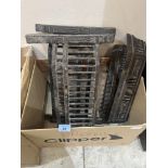 A box of fireplace cast ironware