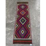 A Suzni Kilim carpet runner. 2.25m x 0.66