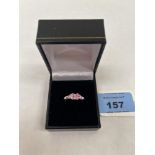 A pink tourmaline and diamond ring. In gold marked 375. 2g gross. size L