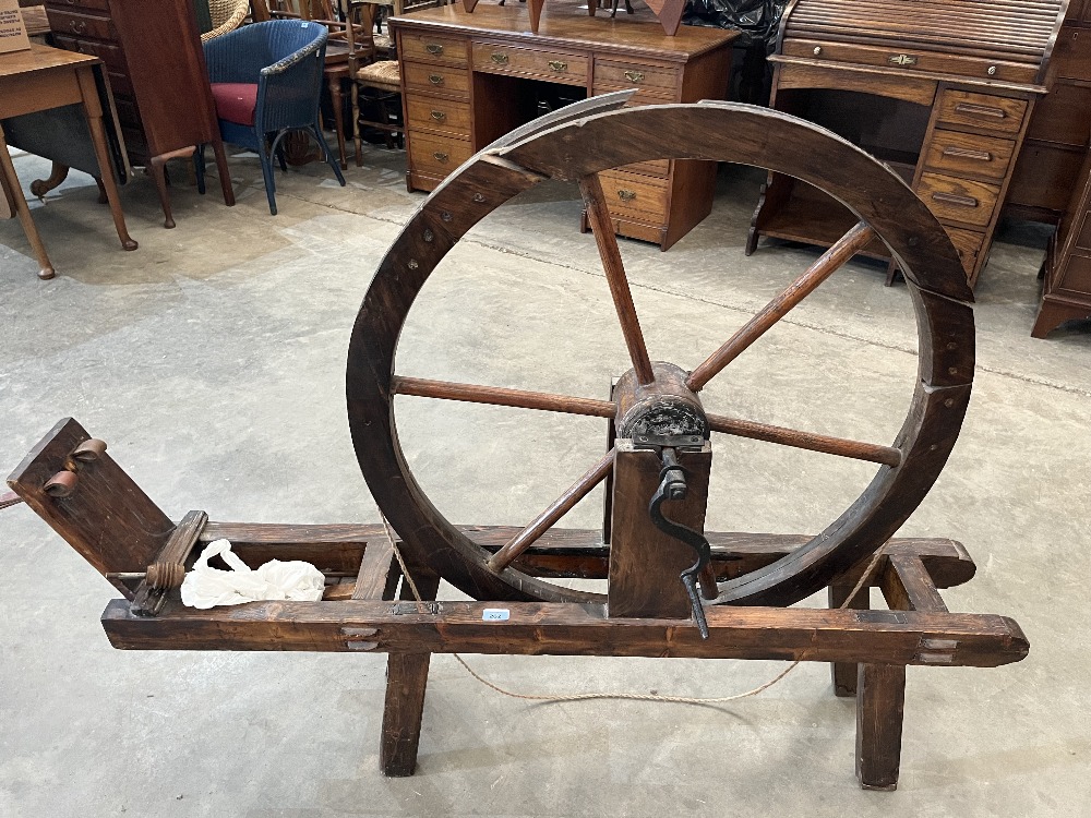 A Scottish muckle spinning wheel. 19th century. The great wheel 33½' diam.