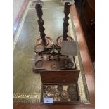 A set of letter scales with a box of weights, together with a pair of oak barleytwist candlesticks