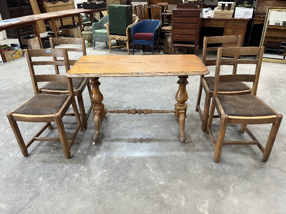 A set of four oak ladderback dining chairs and a Victorian oak centre table on turned trestle