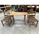 A set of four oak ladderback dining chairs and a Victorian oak centre table on turned trestle