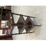 A mahogany three stage etagere 27' high