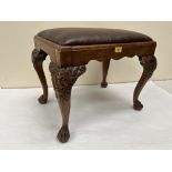 A George II style walnut stool raised on lion carved cabriole legs and paw feet. 23' wide