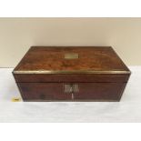 A Victorian brass mounted and line inlaid box, the lid with vacant brass cartouche. Formerly a