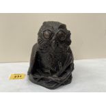 A bronzed metal and resinous model of an owl, the base rim signed Richard Fisher. 5¼' high