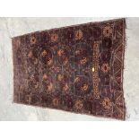 A tobacco ground Belouch rug. 62' x 43'