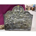 An antique cast iron fireback, moulded with a lion, fleur-de-lys, thistle and a rose 26' x 29½'