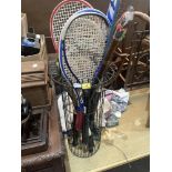 A wire stickstand with arrows, racquets etc.
