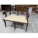 A mahogany double chair-back settee with lyre splats