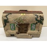 A dolls' house, Wisteria Cottage by Kettleside Cottages, fitted with electric light. 17' wide