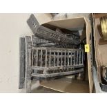 A box of fireplace cast ironware