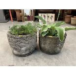 A pair of reconstituted garden pots moulded with animals and fruiting foliage. 12½' high