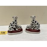 A pair of 19th century porcelaneous Dalmation and puppy groups. Apocryphal Chelsea gold anchor