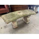 A concrete garden seat. 44' wide