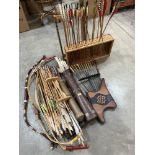 A large quantity of arrows, two arrow stands and three archer's bows