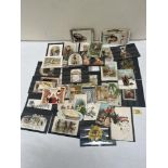 A collection of early 20th century Christmas cards and Valentines. 60 in total