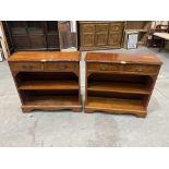 A pair of yew veneered open bookcases each with a pair of frieze drawers. 30' wide