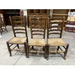 Three 19th century north country ladderback chairs with rush seats