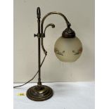 A brass desk lamp with globular shade. 17½' high