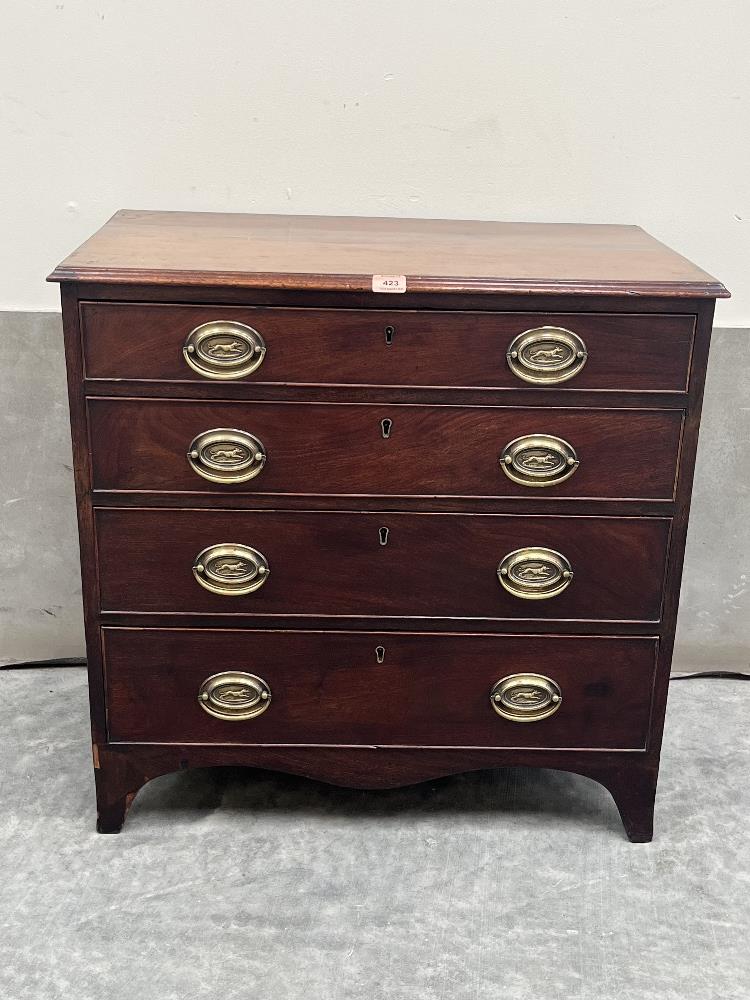 A George III mahogany chest of small size, with four long graduated drawers on slightly splayed