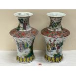 A pair of Chinese famille-rose vases, with continuous decoration of sages and officials in a