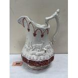 A 19th century pearlware jug, pink lustre decorated and moulded with a continuous band of deer. 8'