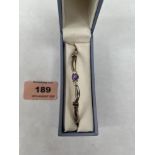 A silver amethyst and white sapphire bangle by David Christopher, London. Original box