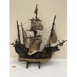 A wooden model of the galleon Santa Maria. 22' high
