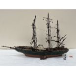 A scratch-built carved wood and painted model of a three masted ship, fully rigged. The hull 21'