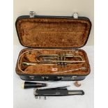 A brass Boosey and Hawkes York International trumpet. Cased. The lot to include a mute, stand and