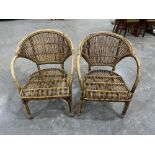 A pair of cane conservatory armchairs