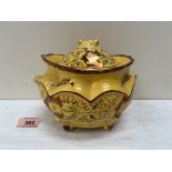 A Victorian yellow glazed and copper lustre decorated tureen and cover. 7' wide