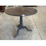 A 19th century oak tripod table. 30' diam. (A.F.)