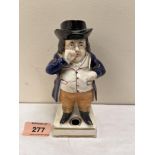 A 19th century Staffordshire figural pen holder. 5¾' high