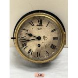 A maritime bulkhead clock with Smith 8 day movement, the enamel dial with Roman numerals and brass