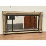A Regency parcel gilt overmantle mirror three plates with ebonised reeded slips flanked by fluted