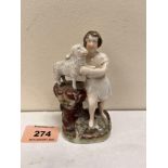 A 19th century Staffordshire group of boy shepherd with lamb. 4' high