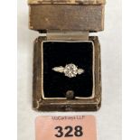 A diamond solitaire ring, the central old cut yellow diamond set in eight claws. Approximate carat