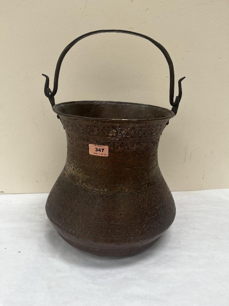 A middle eastern copper vessel with engraved decoration. 11½' high