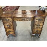A walnut kneehole dressing table on cabriole legs. 41½' wide
