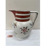 A 19th century pearlware pitcher, freely painted with scattered flowers under an iron red and