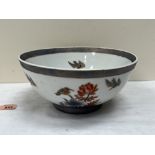 An oriental style bowl painted with flowers and birds. 10' diam
