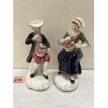 A pair of 19th century Staffordshire figures boy and girl companion each with a bowl of fruit. 6'