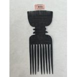 A 19th century African tribal carved treen hair comb. 9¾' high