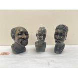 Three African carved stone heads, the lady 5' high. One signed with initials 'NM'